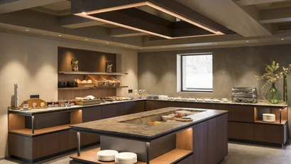 Modernes Frühstücksbuffet mit Brot, Aufstrichen und Geschirr in gemütlichem Raum